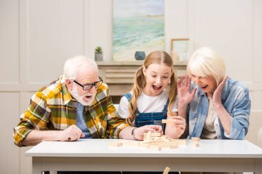 Family playing jenga game clipart