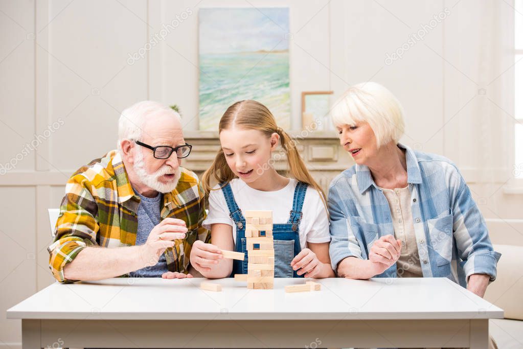Family playing jenga game