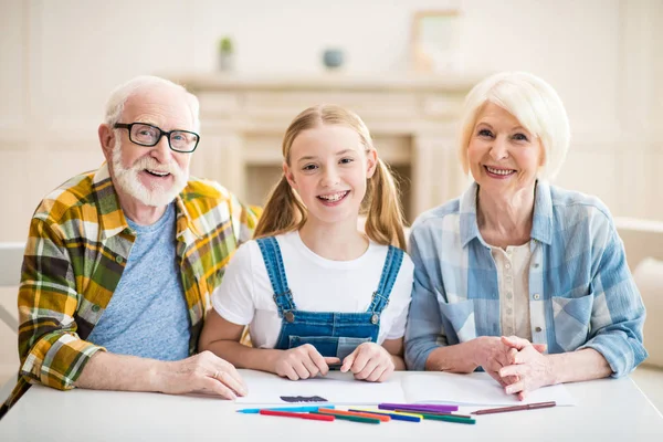 Girl with grandparents drawing — Stock Photo, Image