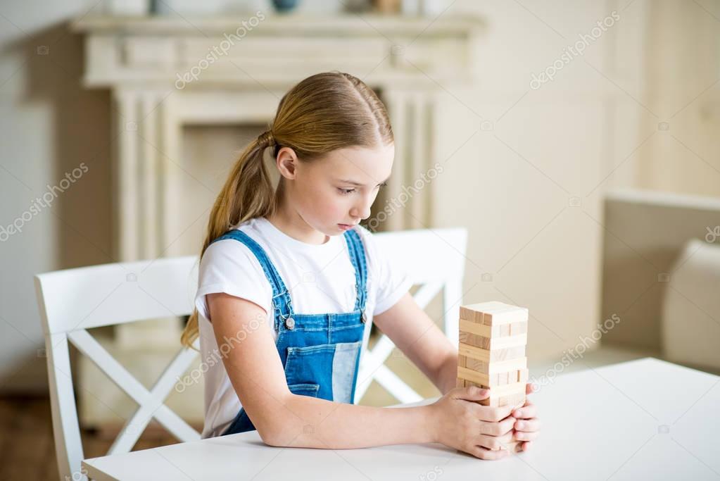 Girl playing jenga game