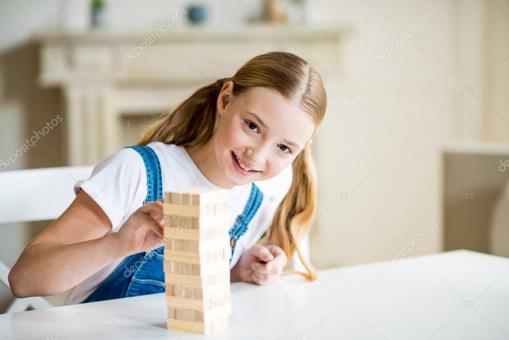 Girl playing jenga game