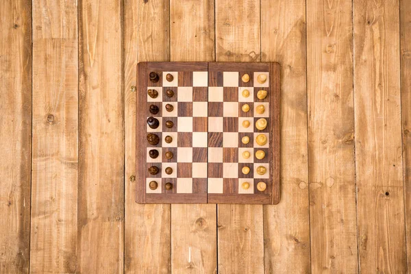 Wooden chessboard with pieces — Stock Photo, Image