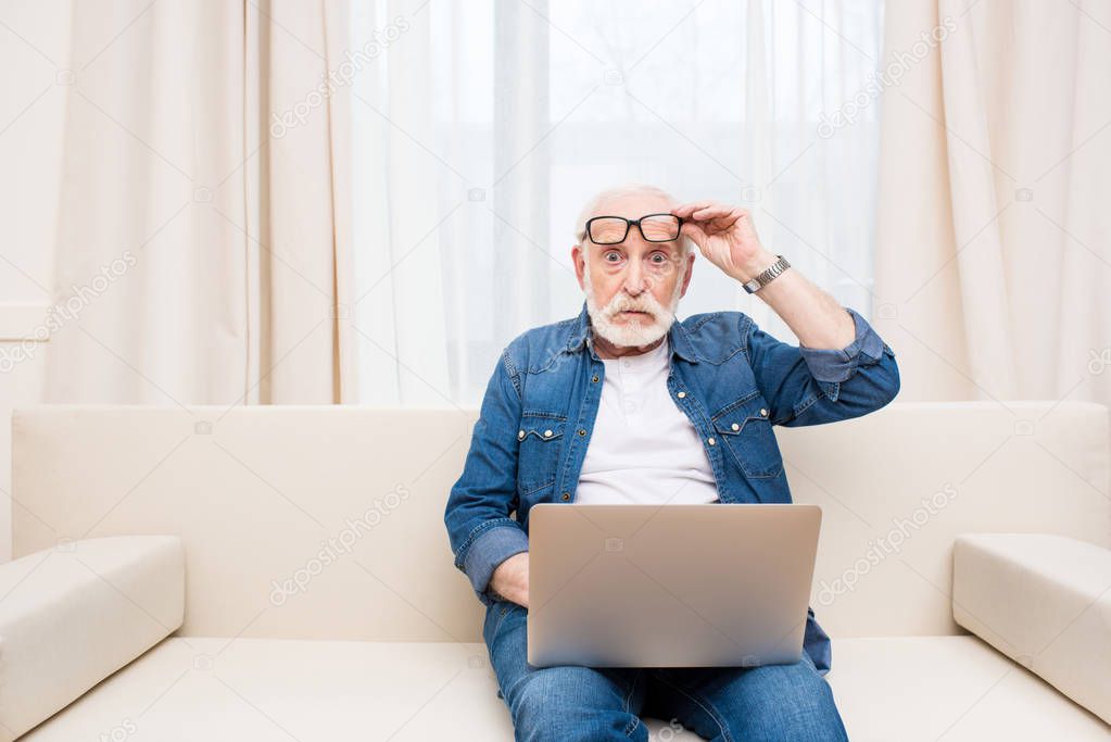 Senior man using laptop