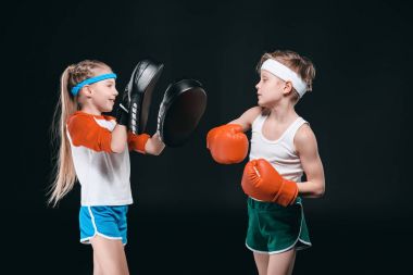 Boy and girl boxing  clipart