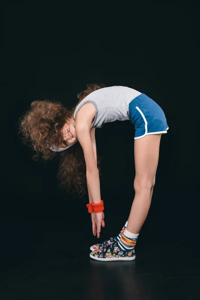 Girl in sportswear exercising — Stock Photo, Image