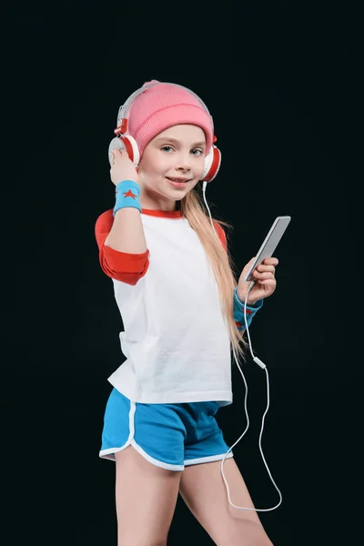 Chica deportiva en auriculares — Foto de stock gratis