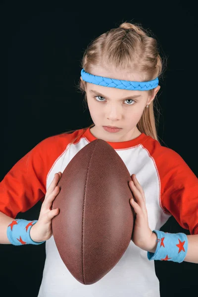 Menina com bola de rugby — Fotografia de Stock