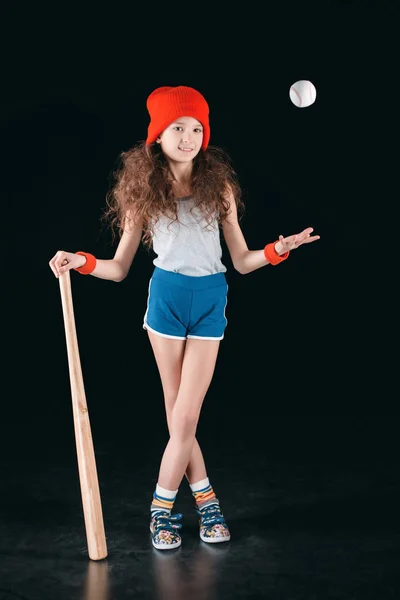 Girl holding baseball equipment — Free Stock Photo
