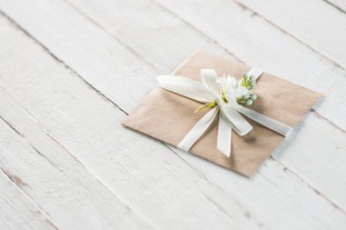 envelope with flower and ribbon clipart