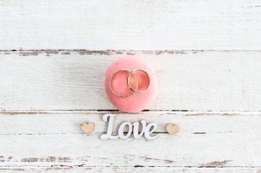 Wedding rings on macaron clipart