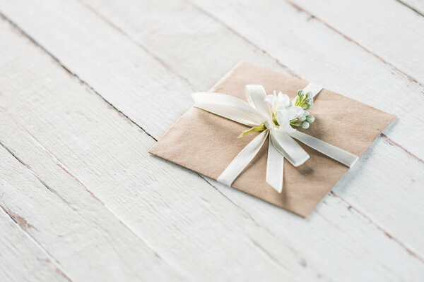 envelope with flower and ribbon