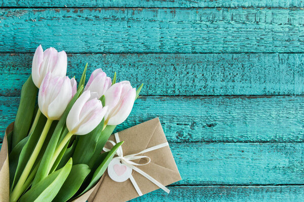 Light pink tulips and envelope Stock Photo