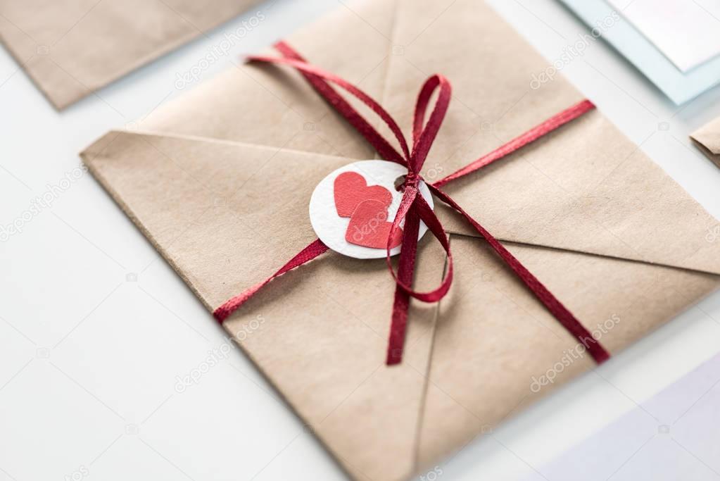 envelope with tag with hearts