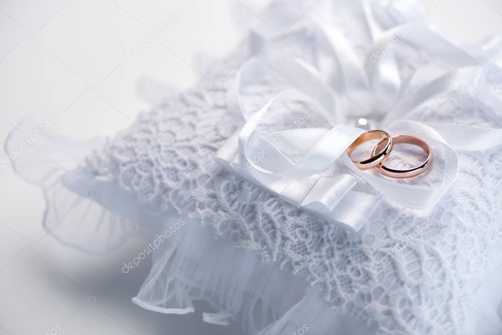 Wedding rings on lace pillow