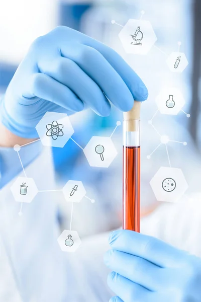 Chemist with test tube in hands — Stock Photo, Image