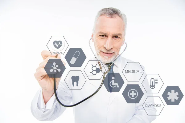 Doctor with stethoscope and medical care icons — Stock Photo, Image