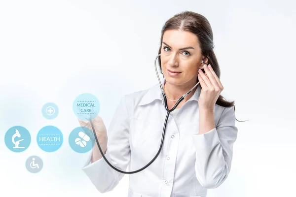 Doctor with stethoscope and medical care icons — Stock Photo, Image