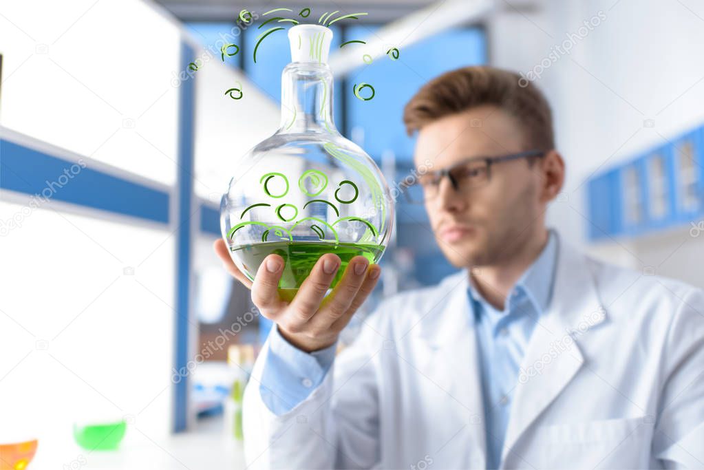 chemist holding flask 