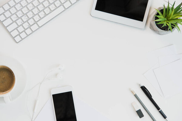 keyboard with office supplies and digital tablet