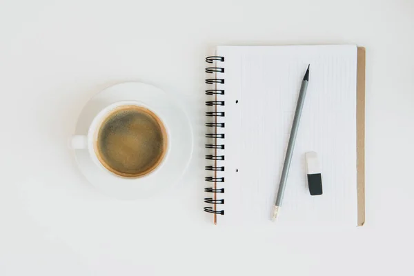 Notebook with pencil and cup of coffee — Stock Photo, Image