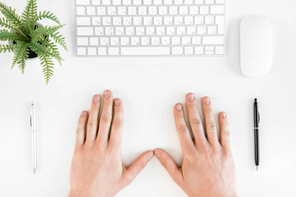 Keyboard and person at workplace 