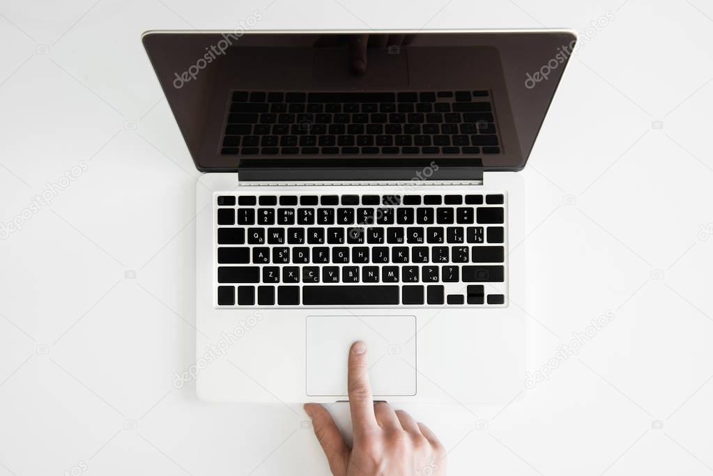 human hand and laptop 
