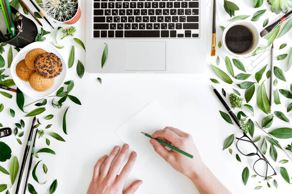 Laptop and person at workplace 