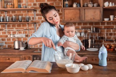 Mother and son baking cookies clipart