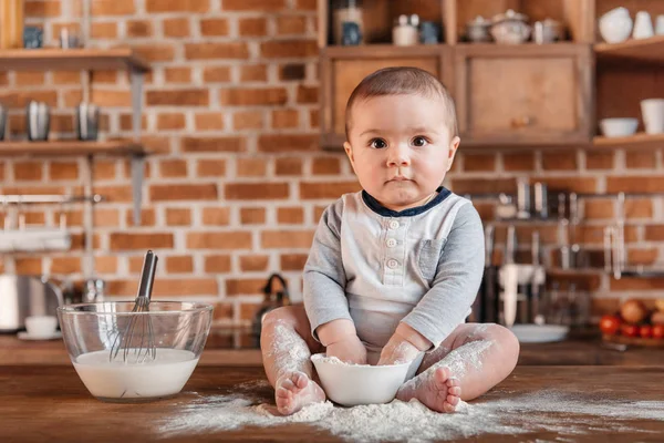 Little boy playing with flour — Stock Photo, Image