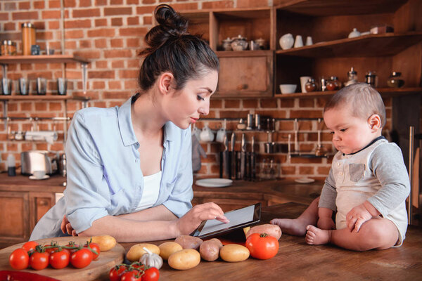 Mother with son in the kitchen