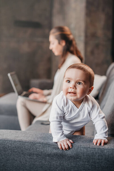 Mother with little boy at home
