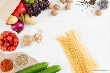 Raw spaghetti and vegetables  clipart