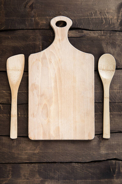 Chopping board with kitchen utensils