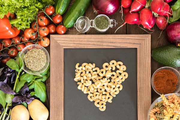 chalkboard with group of fresh vegetables 