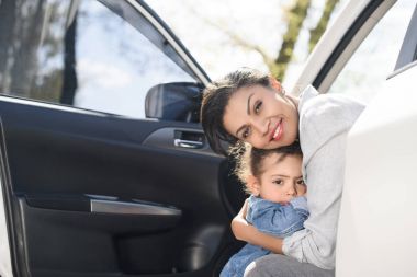 mother and daughter in car clipart