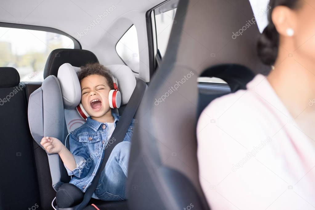 little girl in car