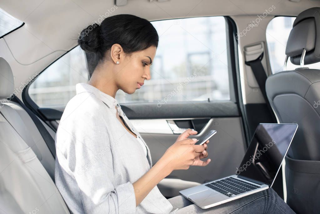 Beautiful woman sitting in car 