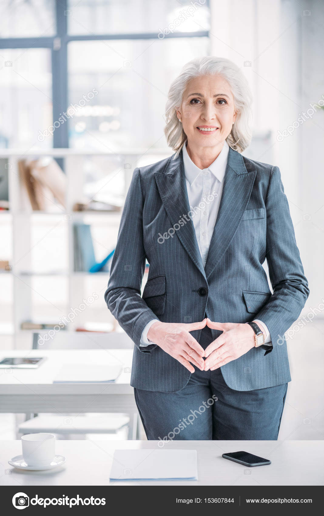 Senior businesswoman at workplace — Stock Photo © IgorTishenko #153607844