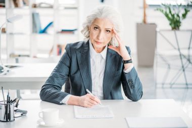 businesswoman signing contract