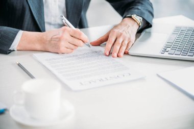 businesswoman signing contract