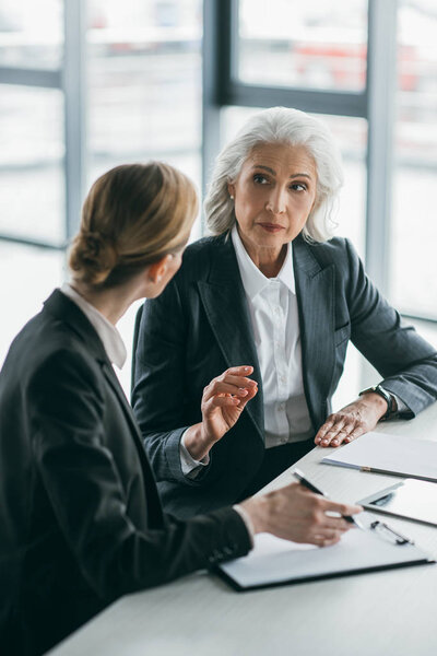 businesswomen discussing project