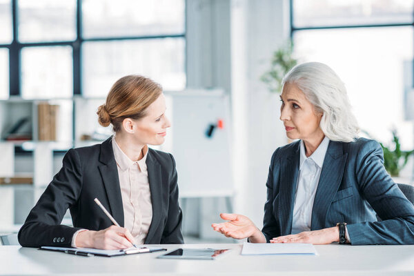 businesswomen discussing project