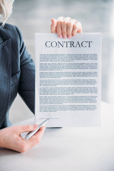 businesswoman pointing at contract