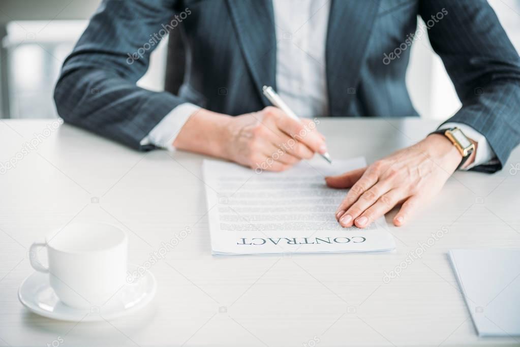 businesswoman signing contract
