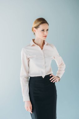 caucasian businesswoman posing and looking aside clipart