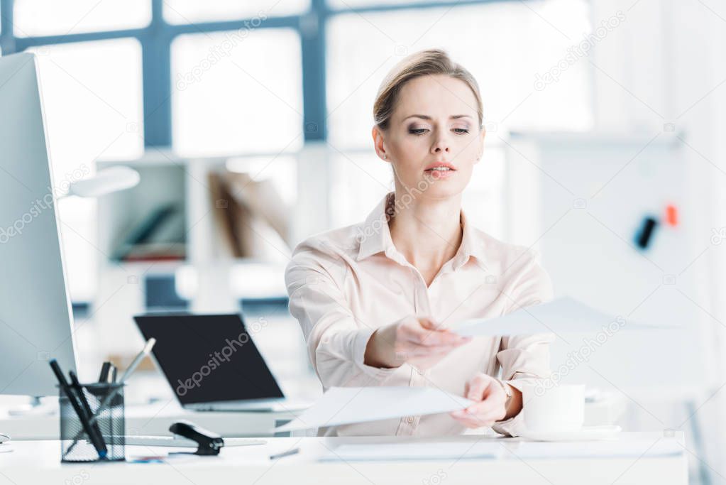 businesswoman working with documents at office