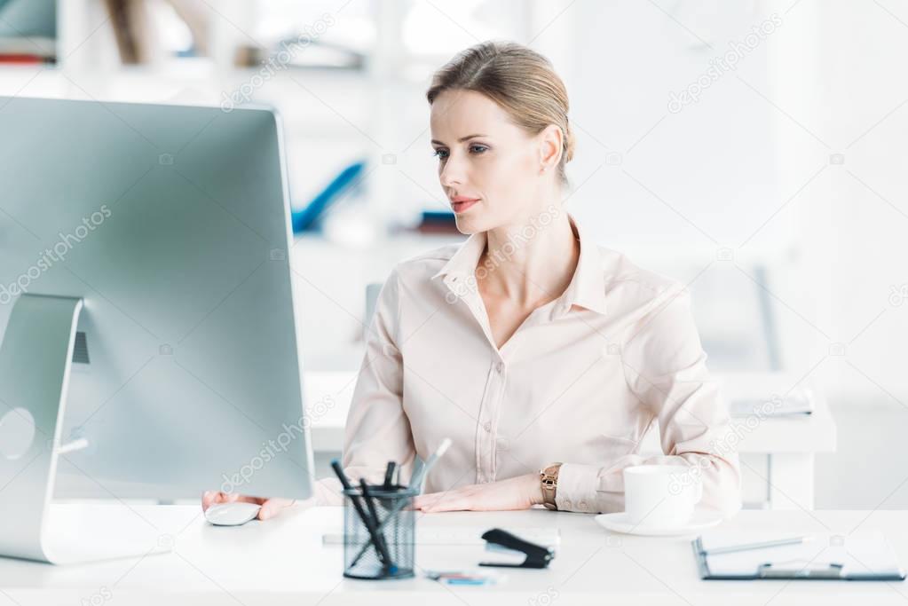 businesswoman working on computer at office