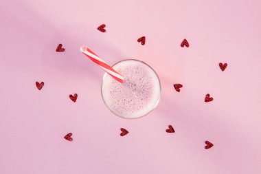 strawberry milkshake in glass with drinking straw clipart