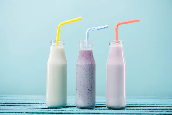 Milkshakes in glass bottles — Stock Photo, Image