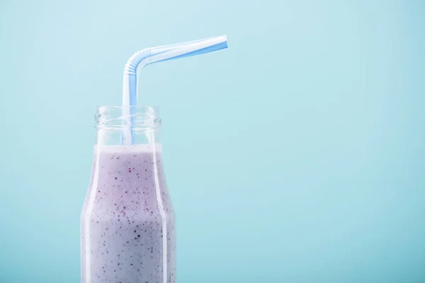 Tasty milkshake in glass bottle — Stock Photo, Image